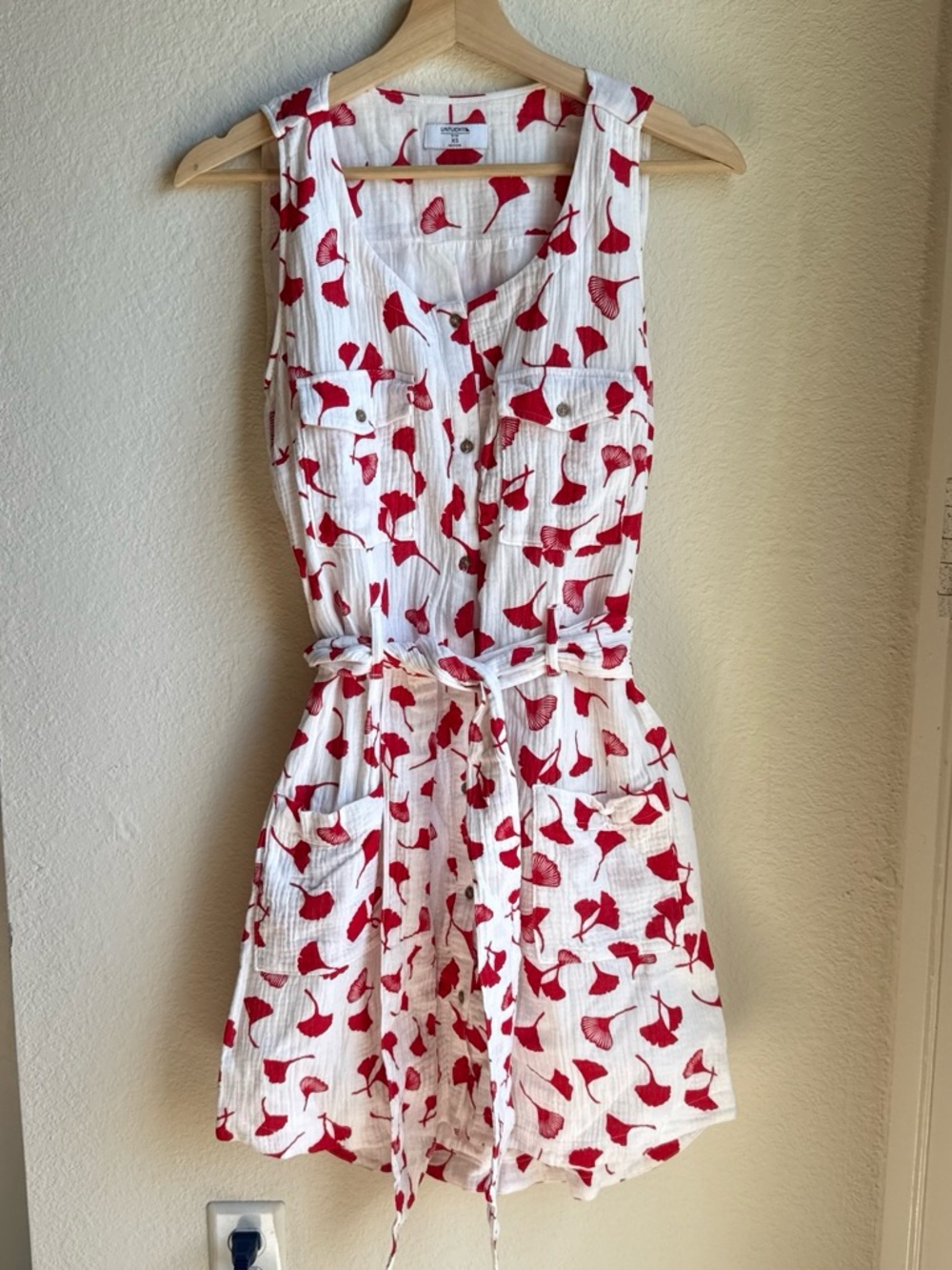 Untuckit Sleeveless White Romper with Red Leaf Print